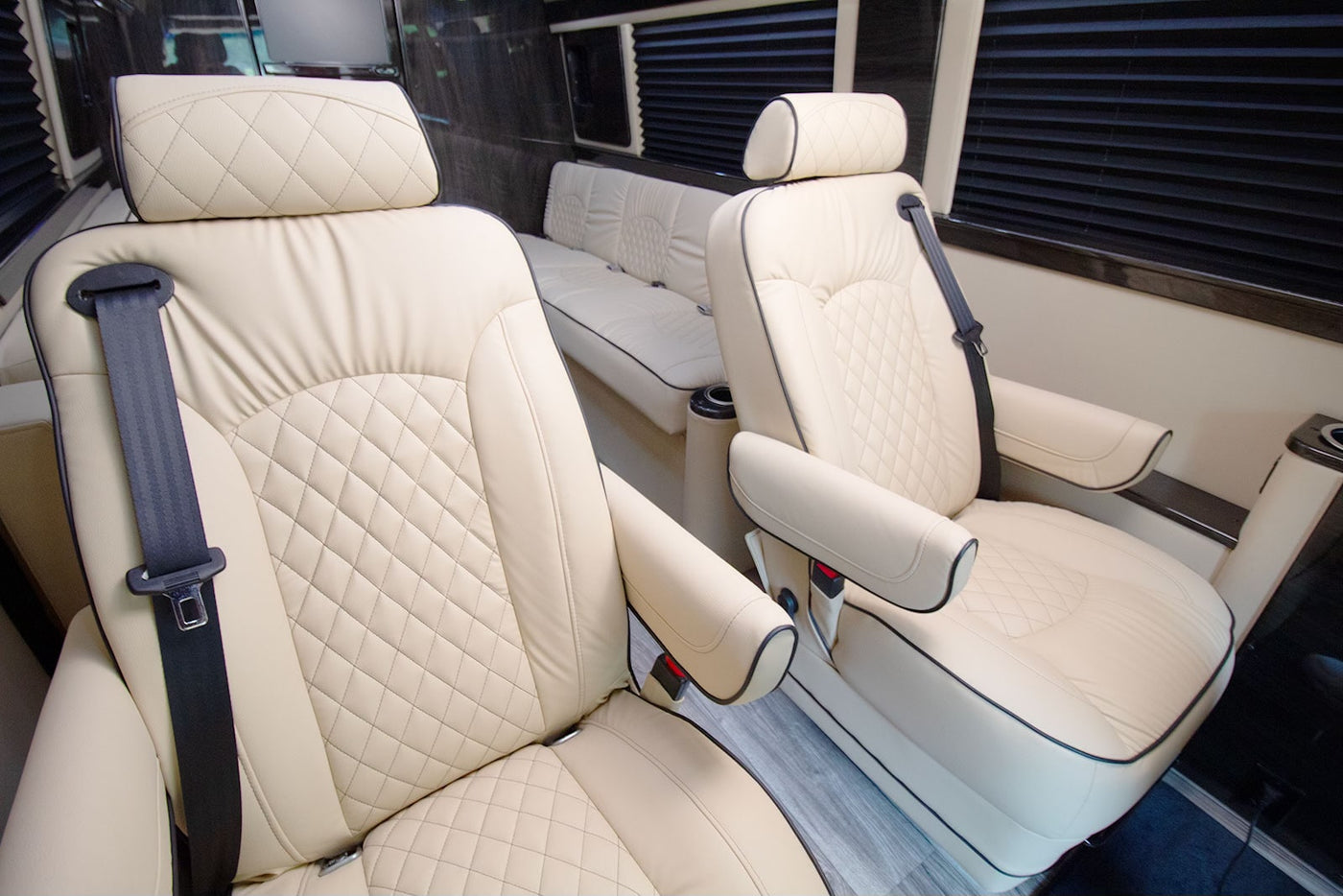  parked on a sunny street near a sidewalk & trees.|Rear view of a black Mercedes-Benz Sprinter 3500 XD van — photo 3