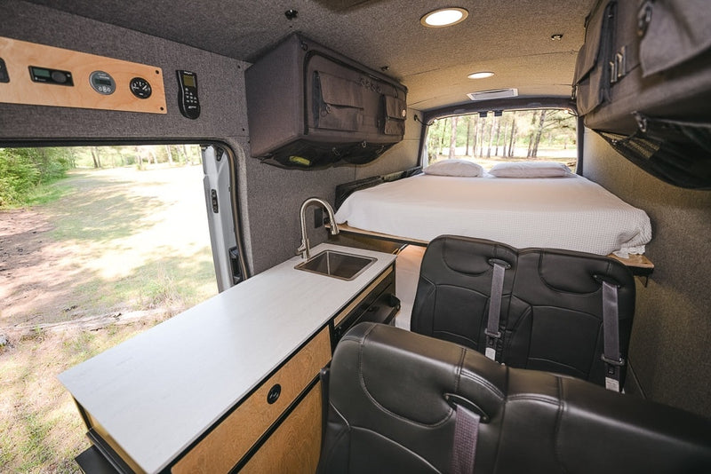  ceiling lights.|This RV rental camper van interior features a compact kitchen — photo 12