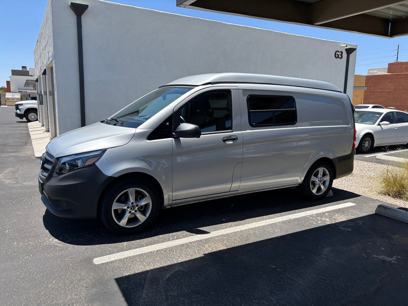 Silver Mercedes-Benz camper van with a pop-top roof, perfect for your next rv rental experience. — photo 2