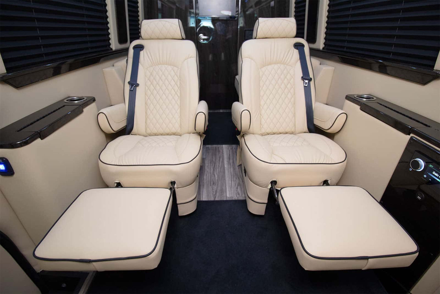  and black countertop. Brightly lit for easy use.|Compact RV rental bathroom: a white toilet against cream walls — photo 8
