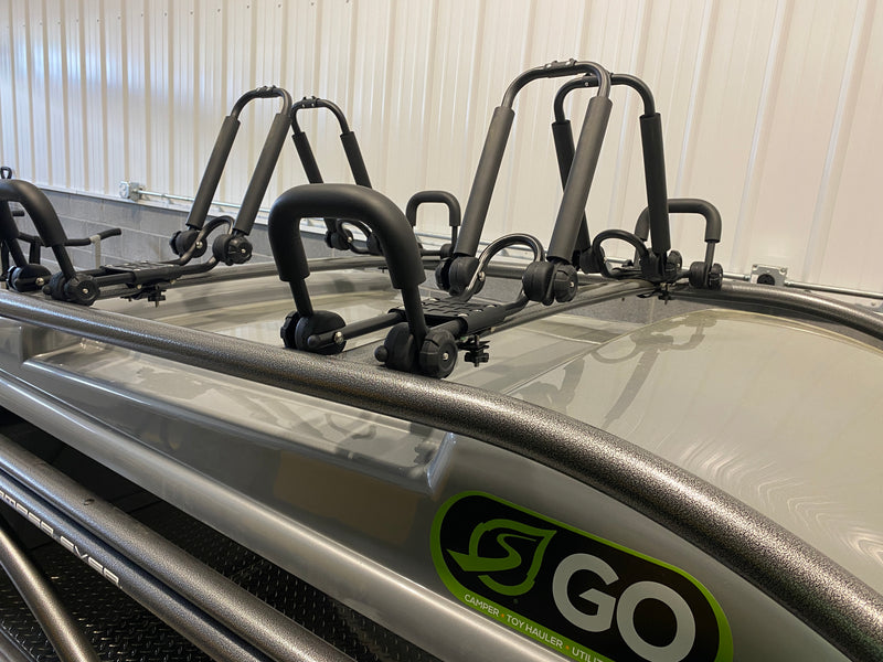 RV rental ready with roof-mounted kayak racks on a "GO" camper toy hauler. Perfect for outdoor adventures. — photo 7