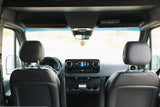 Inside an RV rental: a clear front cabin view with the dashboard, steering wheel, and infotainment screen. Ready for your road trip!