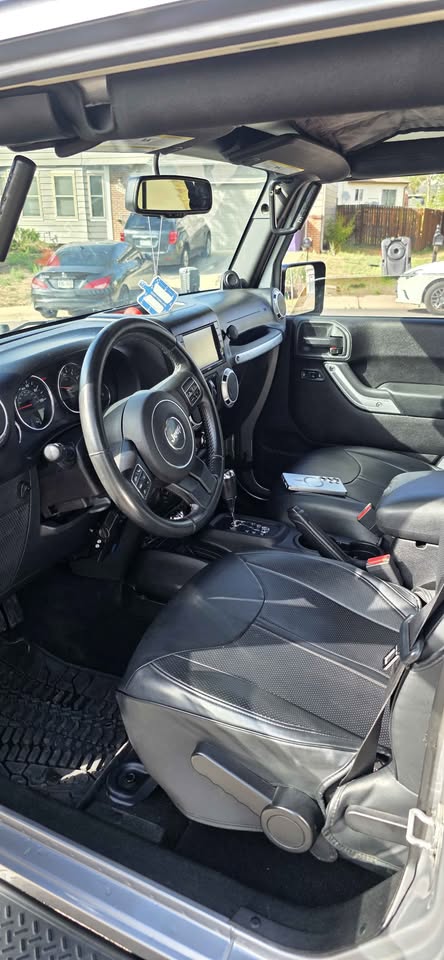 2013 Jeep Wrangler Unlimited · Sahara Sport Utility 4D in Denver, CO (photo 10) — photo 10