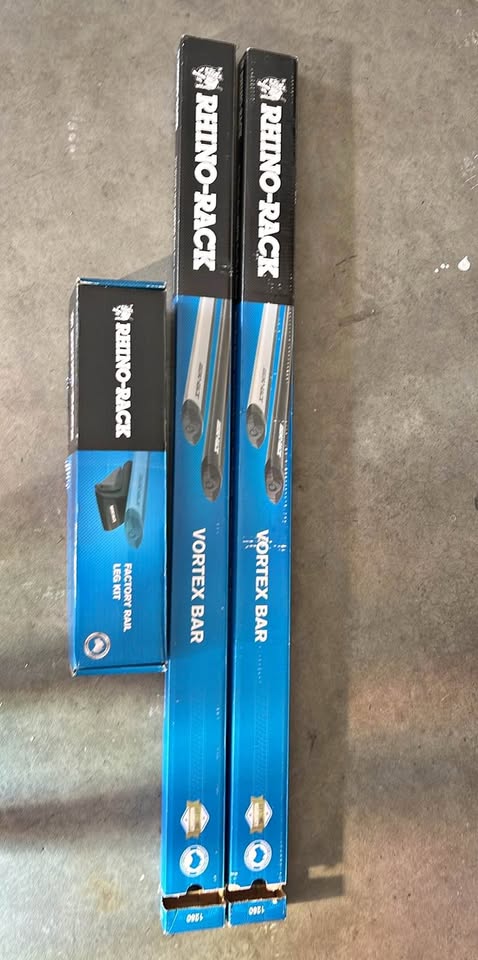 Rhino rack vortex bars 50in black and SX 027 factory rail leg kit