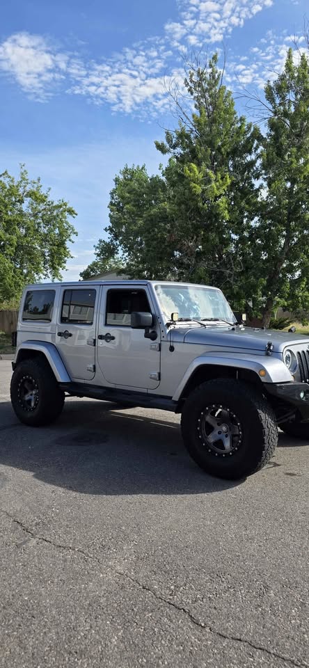 2013 Jeep Wrangler Unlimited · Sahara Sport Utility 4D in Denver, CO (photo 4) — photo 4