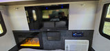 Relax in this RV rental's cozy interior, complete with TV, electric fireplace, stereo, and AC for your comfort.
