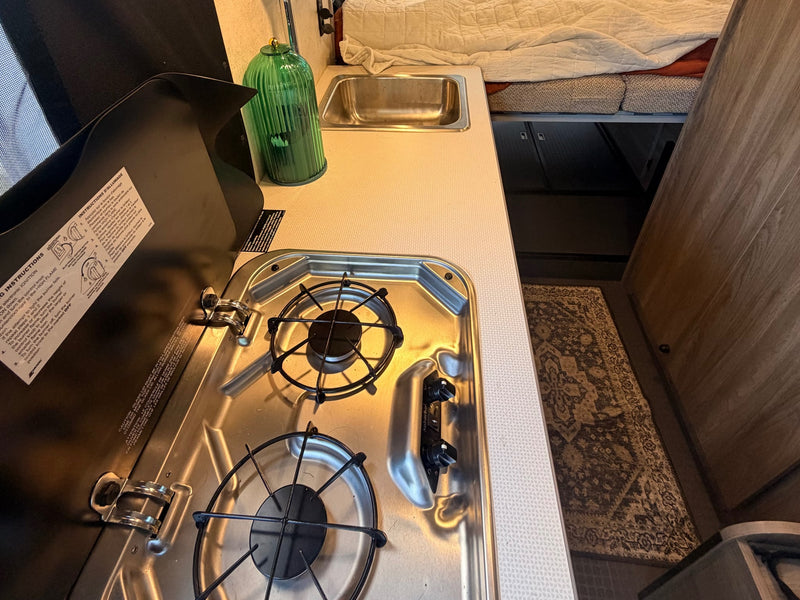  showcasing its interior. Another Solis van is parked behind.|RV rental front cabin interior: dashboard — photo 7