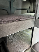 RV rental with comfortable bunk beds and grey bedding, perfect for family adventures.