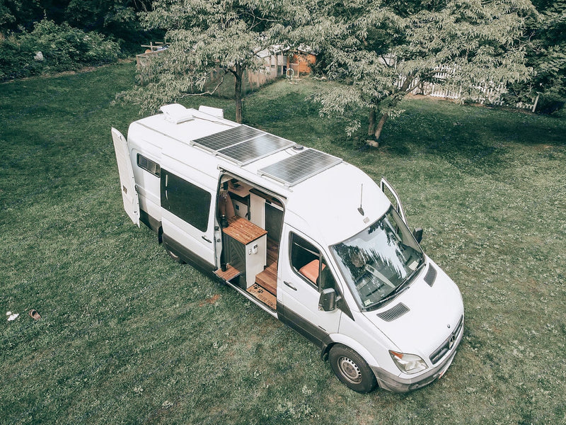  and a dining table.|Inside a spacious RV rental: a comfy bed — photo 4
