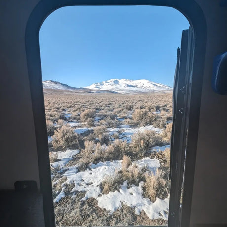 Remote snowy desert and mountain views from an RV rental. Your nature adventure starts here!