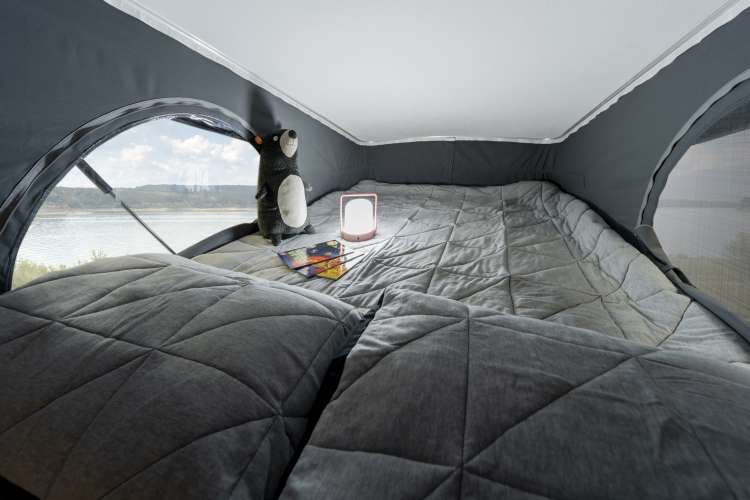  perfect for road trips.|This RV rental's comfy bedroom features a large bed — photo 8