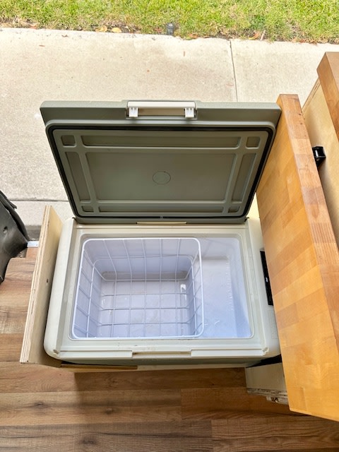  & cozy rug.|Explore this RV rental's custom camper van interior featuring an elevated bed — photo 6