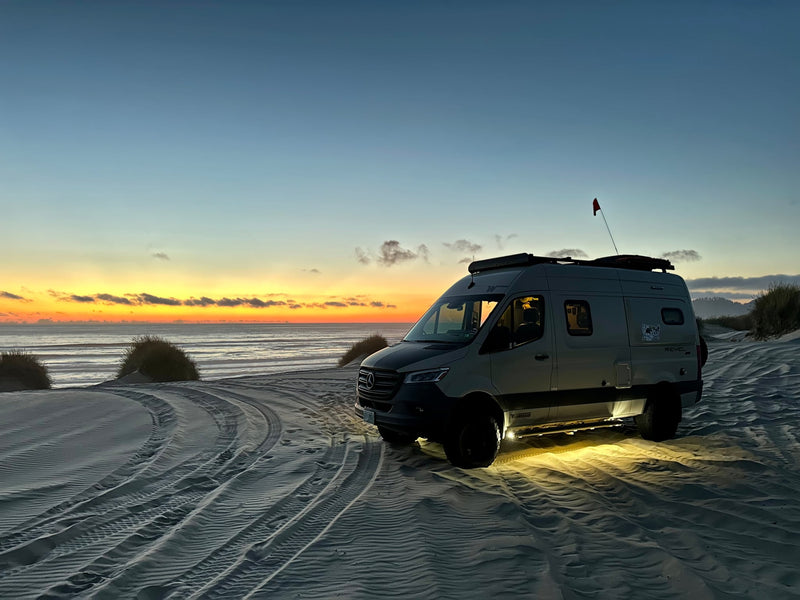  perfect for desert adventure.|Stunning beach RV rental adventure! A camper van sits on sandy dunes at a vibrant sunset by the ocean — photo 6