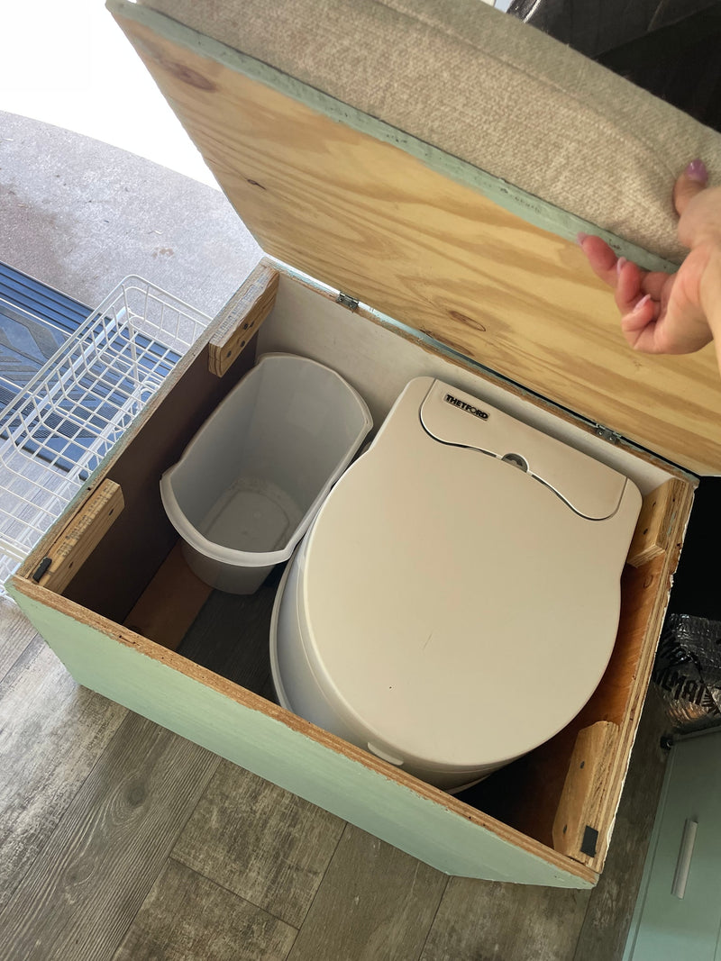 RV rental: Custom box with a Thetford portable toilet and a grey bin for mobile comfort and convenience. — photo 4