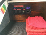 RV rental electrical panel with 12.3V display, light switches, and outlets. A battery state-of-charge chart is visible.