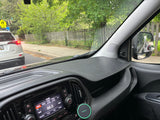 Inside a vehicle, possibly an RV rental, dashboard, 88.5 FM radio, and a white SUV on the road ahead are visible.