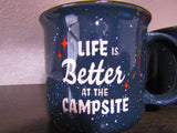 A navy blue speckled mug with red stars and white text "Life is Better at the Campsite," perfect for RV rental trips.