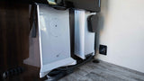 Starlink internet router and USB port provide modern connectivity in this RV rental, with cables neatly managed below a Samsung display.