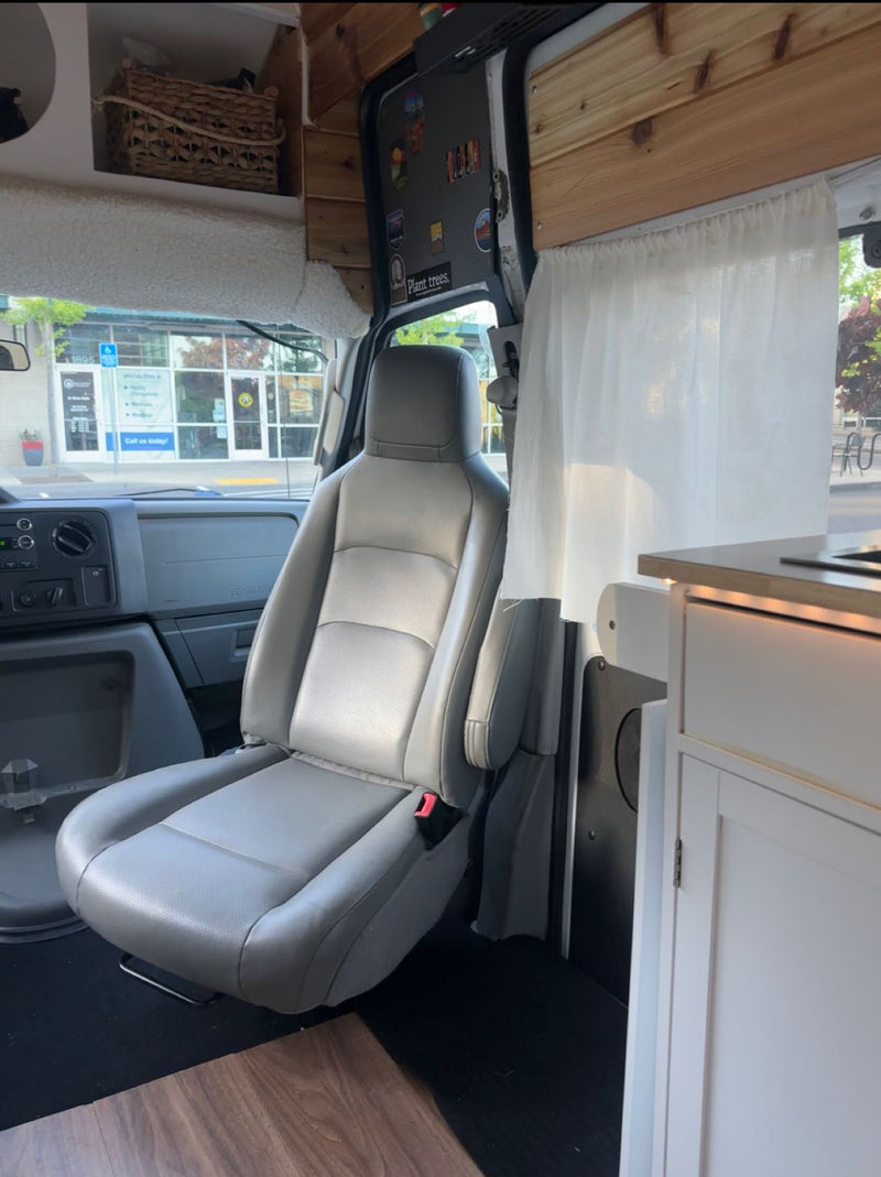  wood-paneled RV rental. Features a comfy bed — photo 9