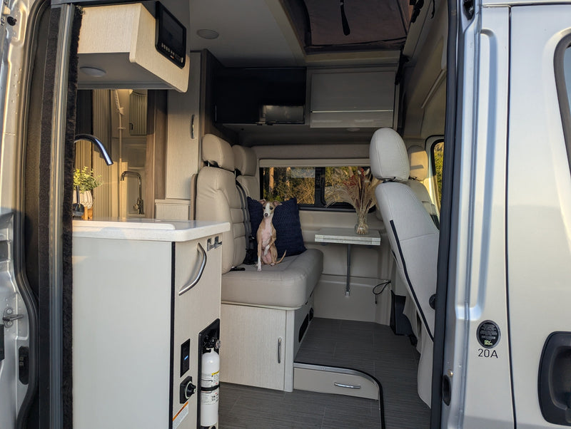  sleeps 4 for your next adventure.|Experience the cozy camper van interior of this rv rental — photo 2