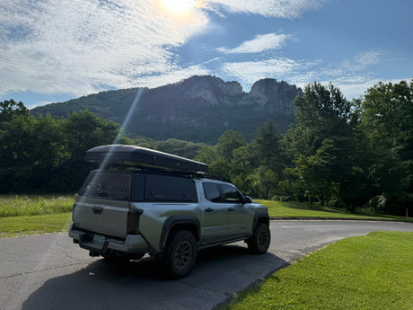  and gear panels. A versatile alternative to an RV rental.|RinseKit portable shower in a truck bed