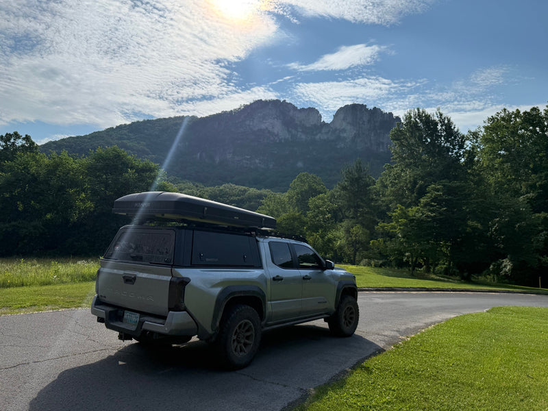  and gear panels. A versatile alternative to an RV rental.|RinseKit portable shower in a truck bed — photo 9