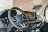 Interior of a Mercedes-Benz RV rental, featuring the modern dashboard and steering wheel.