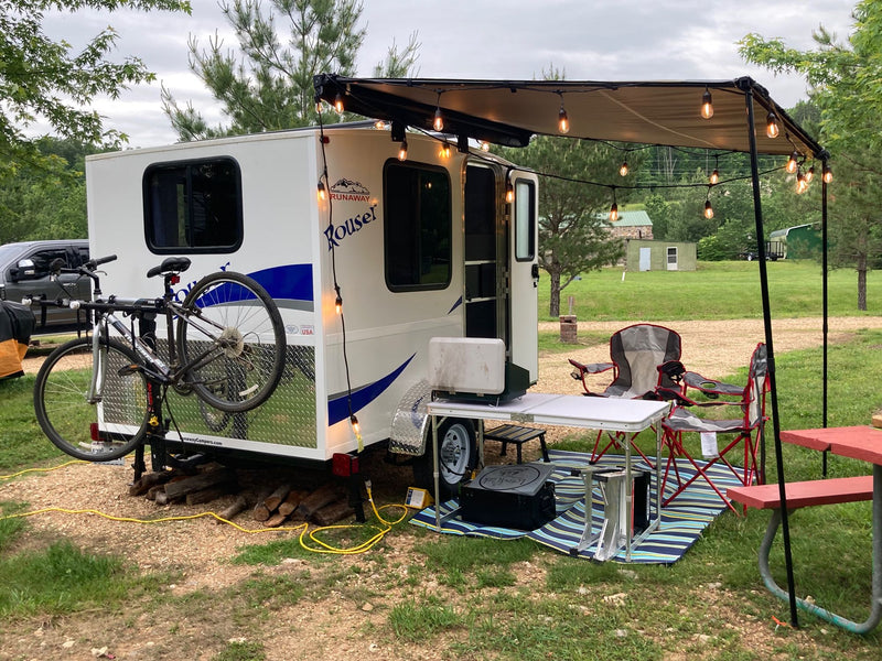 A small white rv rental camper — photo 1