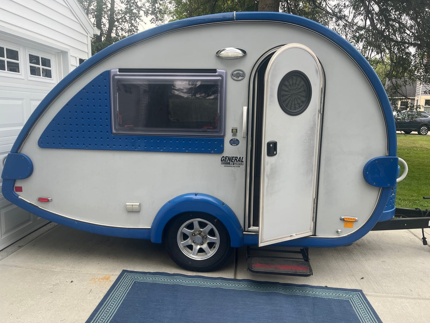 This blue and white teardrop RV rental camper — photo 1