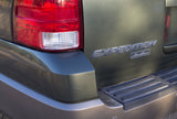 Rear right of a green Ford Expedition SUV with tail light and 'Eddie Bauer' badge. A large vehicle for your next rv rental adventure.