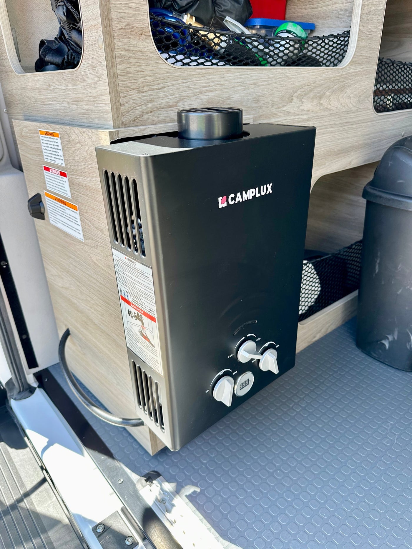 Camplux tankless water heater in an RV rental, essential for hot water during camping and van life. — photo 16