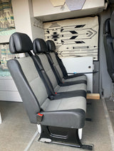 Spacious RV rental interior: three passenger seats, bunk bed, and storage. Perfect for road trips.