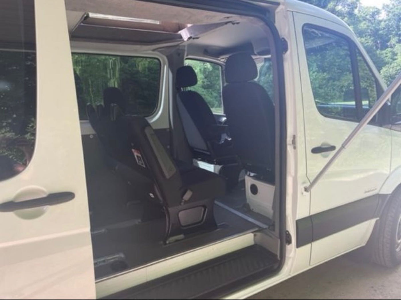  and overhead lights for comfortable travel.|White camper van with a raised pop-top tent — photo 8