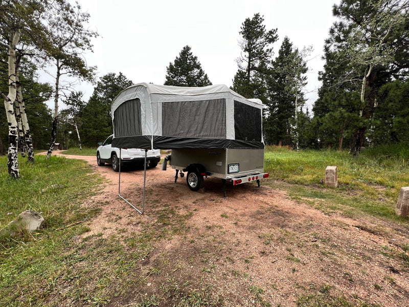  and view of parked cars.|A grey pop-up camper trailer — photo 3