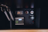 RV rental control panel showing a Xantrex inverter, Zamp solar charger, water gauges, Webasto heater, hot water, and water pump controls.