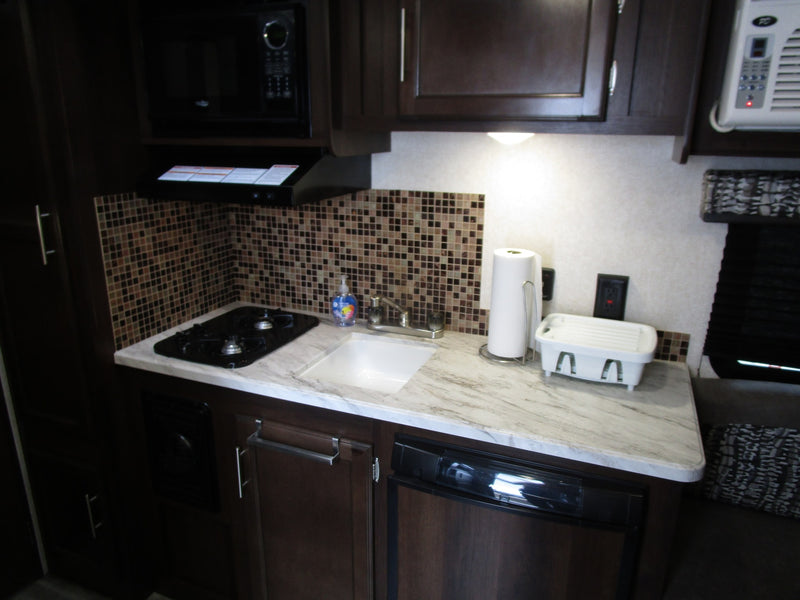  ideal for RV rental adventures. Parked with propane tank and rolled awning.|This Jayco Jay Flight SLX BAJA travel trailer — photo 4