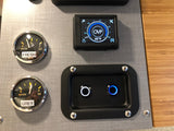 RV rental control panel shows fresh/grey water gauges at 1/2, a digital display (95°F, OVP), and illuminated function buttons.