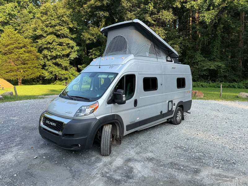 Silver campervan rv rental with an open pop-top roof — photo 1