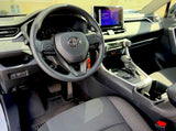 Modern car interior: steering wheel, dashboard, touchscreen display, and gear shift. Ready for your next rv rental road trip.