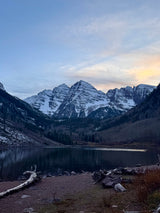 Majestic Maroon Bells mountains and lake at dawn, a stunning backdrop for your next RV rental adventure.