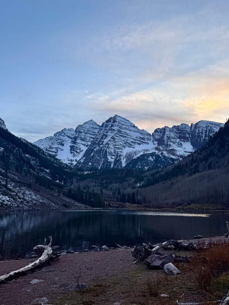 Majestic Maroon Bells mountains and lake at dawn, a stunning backdrop for your next RV rental adventure.