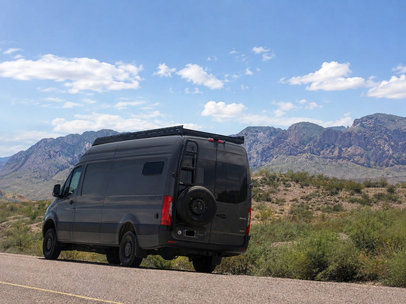 A dark gray Ventur rv rental camper van — photo 1