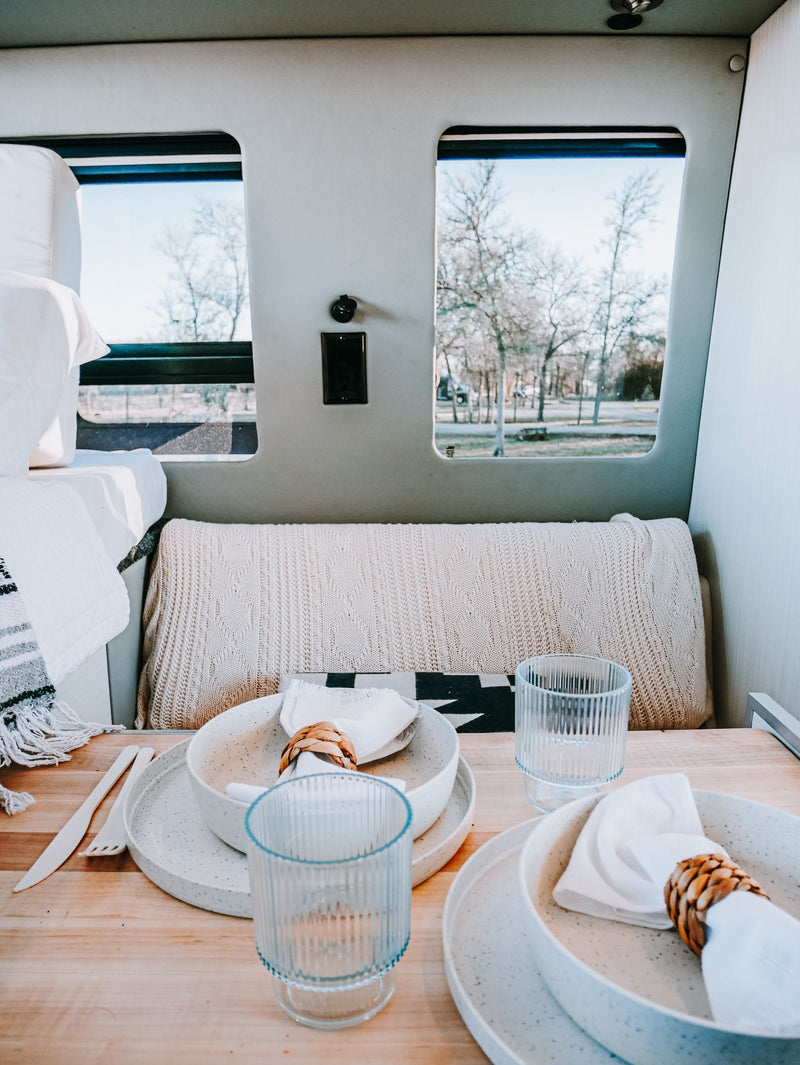  and panoramic views of a vast field make for comfortable travel.|Spacious RV rental interior: comfy bed — photo 7