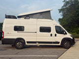  ideal for adventurous road trips.|White Winnebago Solis camper van with pop-top roof