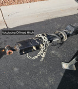 This articulating offroad hitch, crucial for rv rental adventures, offers superior trailer flexibility & safe towing on rugged terrain.