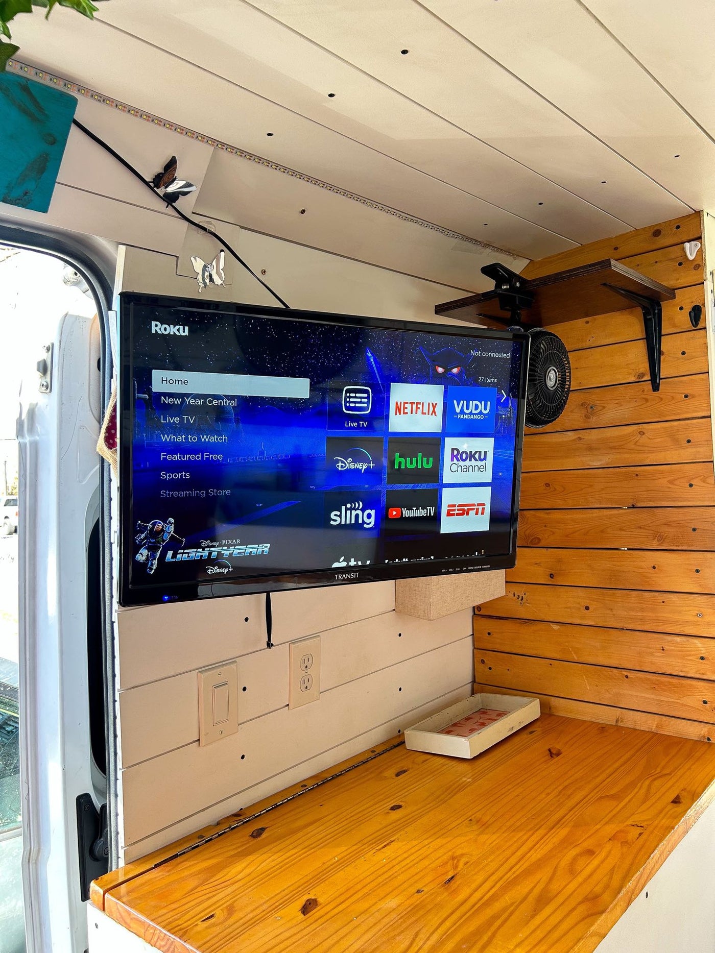  & lower cabinets for compact clothing storage.|This RV rental kitchen features a white sink — photo 13