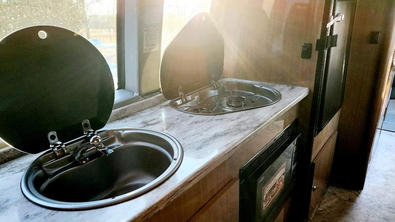  perfect for road trips. Features comfortable seating and a table.|Bright RV rental interior featuring a dinette — photo 3