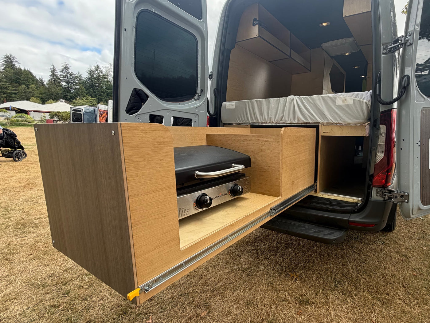  perfect for your next RV rental adventure.**|Stylish custom Mercedes Sprinter RV rental with mountain and topographic design — photo 9