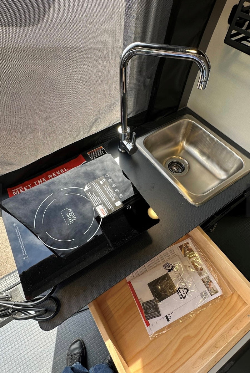  & power management panel.|Step inside this RV rental: a compact interior features a kitchenette — photo 6