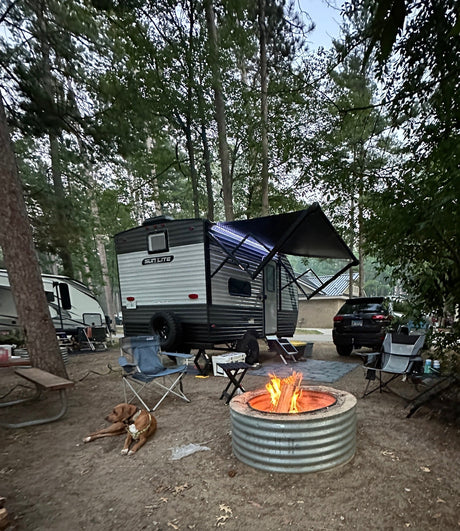 Serene RV rental campsite: glowing campfire